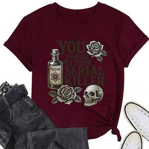 Flat lay of burgundy cotton T-shirt featuring vintage poison and skull graphic prints
