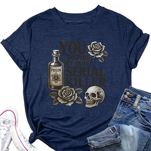 Flat lay of vintage navy t-shirt with skull and rose print, paired with jeans and shoes