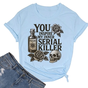 Flat lay of light blue t-shirt with retro rose and skull print paired with ripped denim jeans