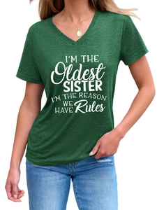 Detail of forest green V-neck T-shirt with white Oldest Sister slogan text on chest