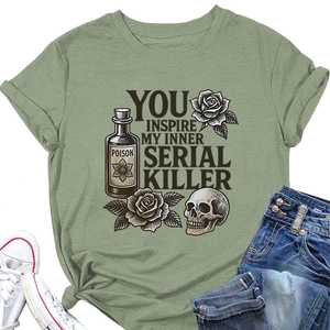 Flat lay of sage green T-shirt with vintage graphic and distressed jeans and shoes