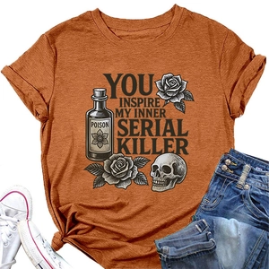 Flat lay of caramel T-shirt with vintage skull print paired with jeans and shoes