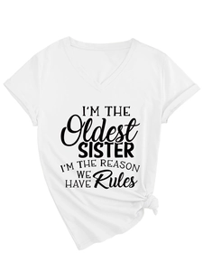 Detail of white V-neck T-shirt featuring oldest sister slogan print and bottom knot design