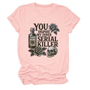 Close-up of vintage skull and rose graphic print on soft pink cotton t-shirt fabric