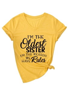 Detail of yellow V-neck t-shirt featuring a funny slogan print and stylish front knot