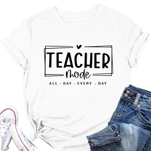 Flat lay of teacher mode t-shirt with denim shorts and sneakers for casual styling