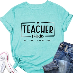 Detailed view of Turquoise Teacher Mode T-shirt with black lettering and heart print