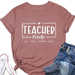Detail showing rolled sleeves and TEACHER MODE print on a dusty rose cotton t-shirt