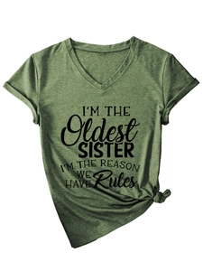 Detail of army green V-neck t-shirt with I'M THE OLDEST SISTER print and side knot