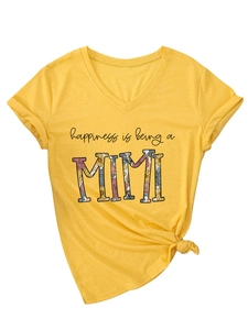 Detail of yellow V-neck T-shirt with 'happiness is being a MIMI' print and front knot hem