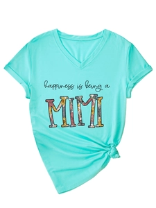 Detail of mint green V-neck T-shirt with flower MIMI print and stylish front hem knot