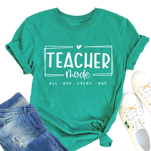 Detail view of light green Teacher Mode t-shirt with blue denim jeans and white sneakers