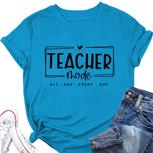 Detail of blue T-shirt with Teacher Mode print styled with jeans and white sneakers