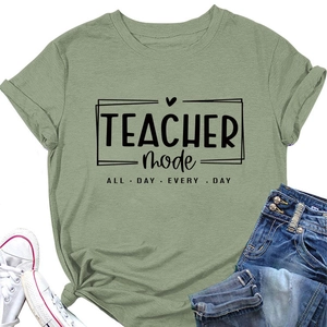 Flat lay of sage green teacher mode cotton t-shirt with cuffed sleeves and accessories