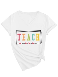 Detailed close-up of 'Teach Them To Be Kind' colorful print and front knot on white V-neck T-shirt