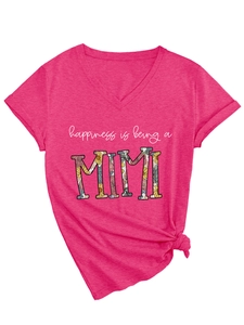 Detail of the rose red V-neck T-shirt showing floral Mimi print and side knot hem