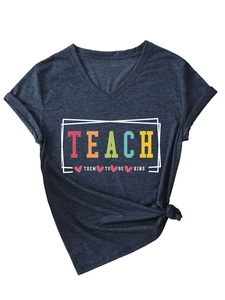 Close-up of V-neck dark blue heather t-shirt with Teach Them To Be Kind slogan and side knot