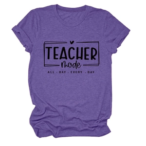 Close-up of purple teacher mode t-shirt showing fabric texture and black slogan print