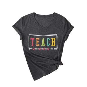 Women's V-neck dark grey T-shirt featuring a colorful 'Teach Them To Be Kind' slogan print