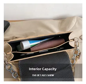 Internal capacity of beige quilted chain bag with double compartments and zip pocket