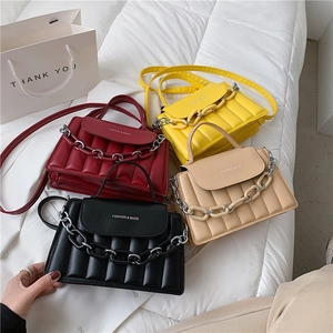 Modern quilted crossbody bags with chunky chain handles in black, red, yellow and beige