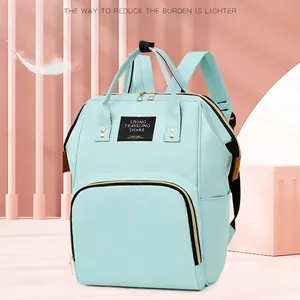 Sac à dos à langer vert menthe en tissu léger avec finition résistante à l'eau