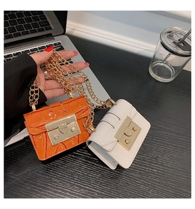 Miniature orange and white faux crocodile skin bags with elegant gold chains
