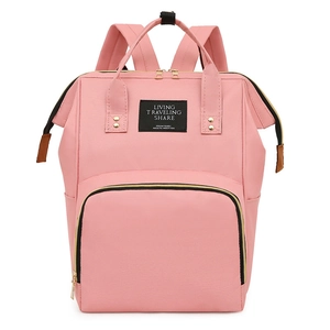Sac à dos à langer rose en toile multifonctionnel avec poignées et poches zippées