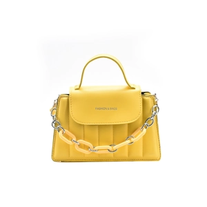 Bright yellow quilted crossbody bag with top handle and decorative chunky chain strap