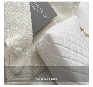 Detail showing white quilted leather bag with precision stitching and tweed fabric texture