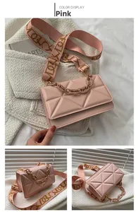 Detailed view of pink quilted handbag with broad strap and thick chain handle