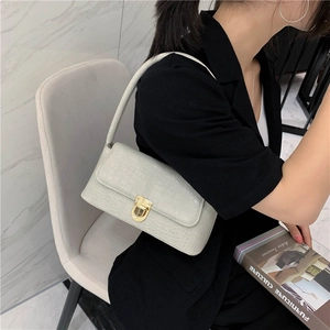 Chic cream crocodile embossed baguette shoulder bag with golden metal twist lock for women