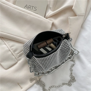 Chic silver rhinestone handbag with dual chain straps showing spacious interior for makeup