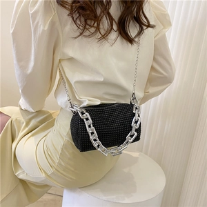 Chic black rhinestone cylinder shoulder bag with bold silver metal chain decoration