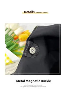 Detail of silver magnetic buckle closure on a black woven shoulder tote bag with canvas lining