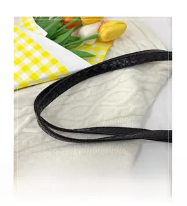 Detailed view of black woven shoulder strap texture for large capacity tote bag