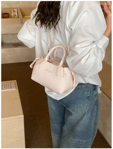 Lifestyle view showing the stylish crossbody leather tote bag worn by a model in casual setting