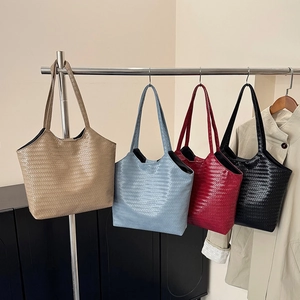 Classic woven tote bag in khaki, blue, burgundy and black displayed on metal hangers