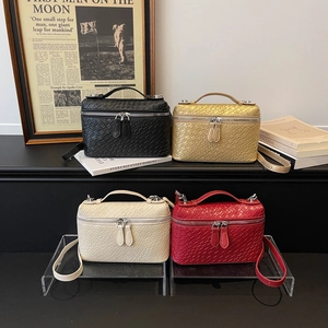 Structured woven texture vanity crossbody bags in black, gold, cream, and red colors