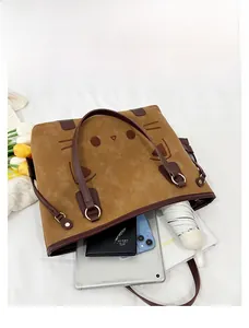 Top view of large tote bag interior showing capacity for iPad, notebook and folding umbrella