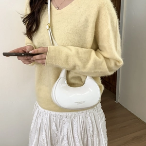 Minimalist white patent leather saddle bag with adjustable shoulder strap for women