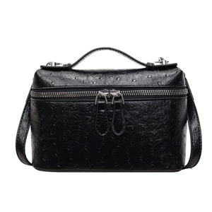 Elegant black ostrich embossed box handbag with top handle and silver zipper details