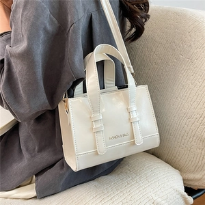 White PU leather tote bag with FASHION & BAGS print and adjustable shoulder strap