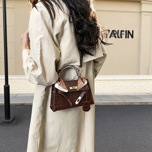 Dark brown crocodile pattern Kelly handbag with silk scarf and gold hardware accents