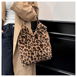 Detail of leopard print faux fur tote bag showing the soft texture and woven strap