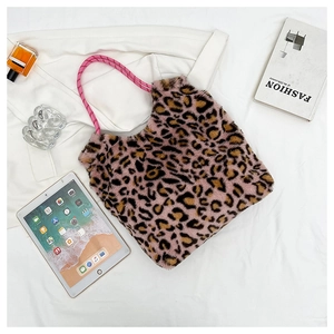 Detail of pink leopard plush tote bag with soft faux fur texture and woven rope handle