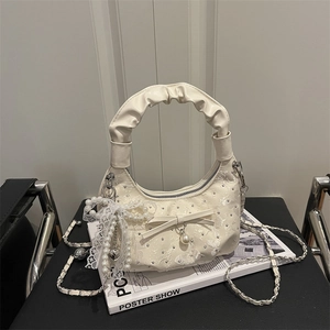 White pleated half-moon handbag with floral embroidery and pearl lace bow charms