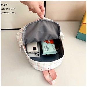 Internal view of plaid school bag showing large capacity for power bank and phone