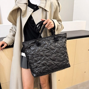 Fashionable black star quilted tote bag with chunky rope handles for women