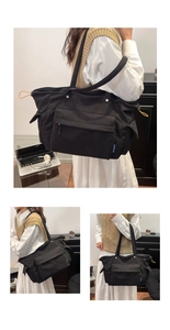Dettaglio macro della borsa tote in velluto a coste nero con coulisse arancione e tasche